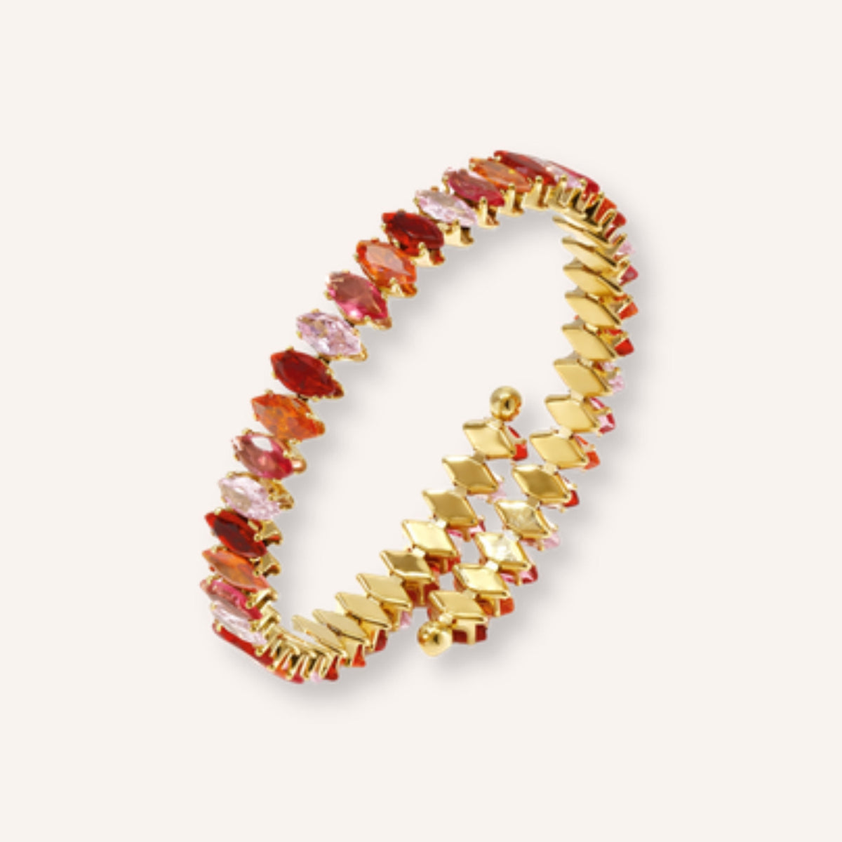 Ellisse Armband – goudkleurige cuff met rode steentjes