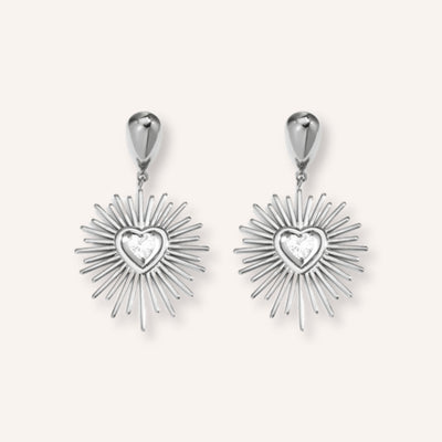 Fulgida Oorbellen Zilver – zilverkleurige zon-oorbellen met hartje
