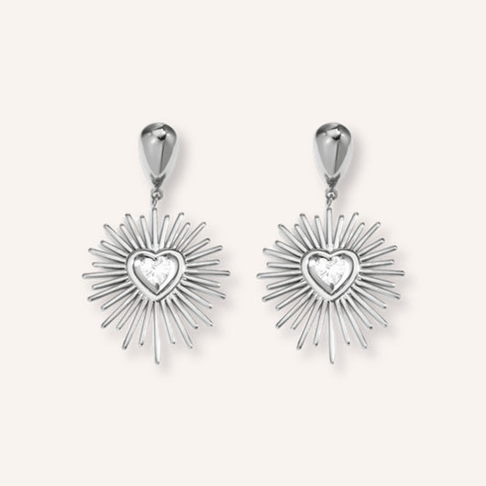 Fulgida Oorbellen Zilver – zilverkleurige zon-oorbellen met hartje