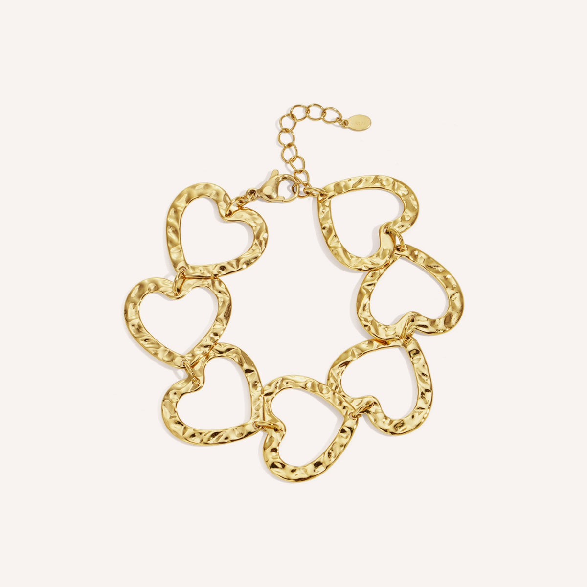 Baia Armband, goudkleurige kettingarmband met hartdetail