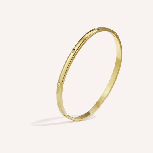 Iseo Armband, ronde goudkleurige bangle met strass-steentjes