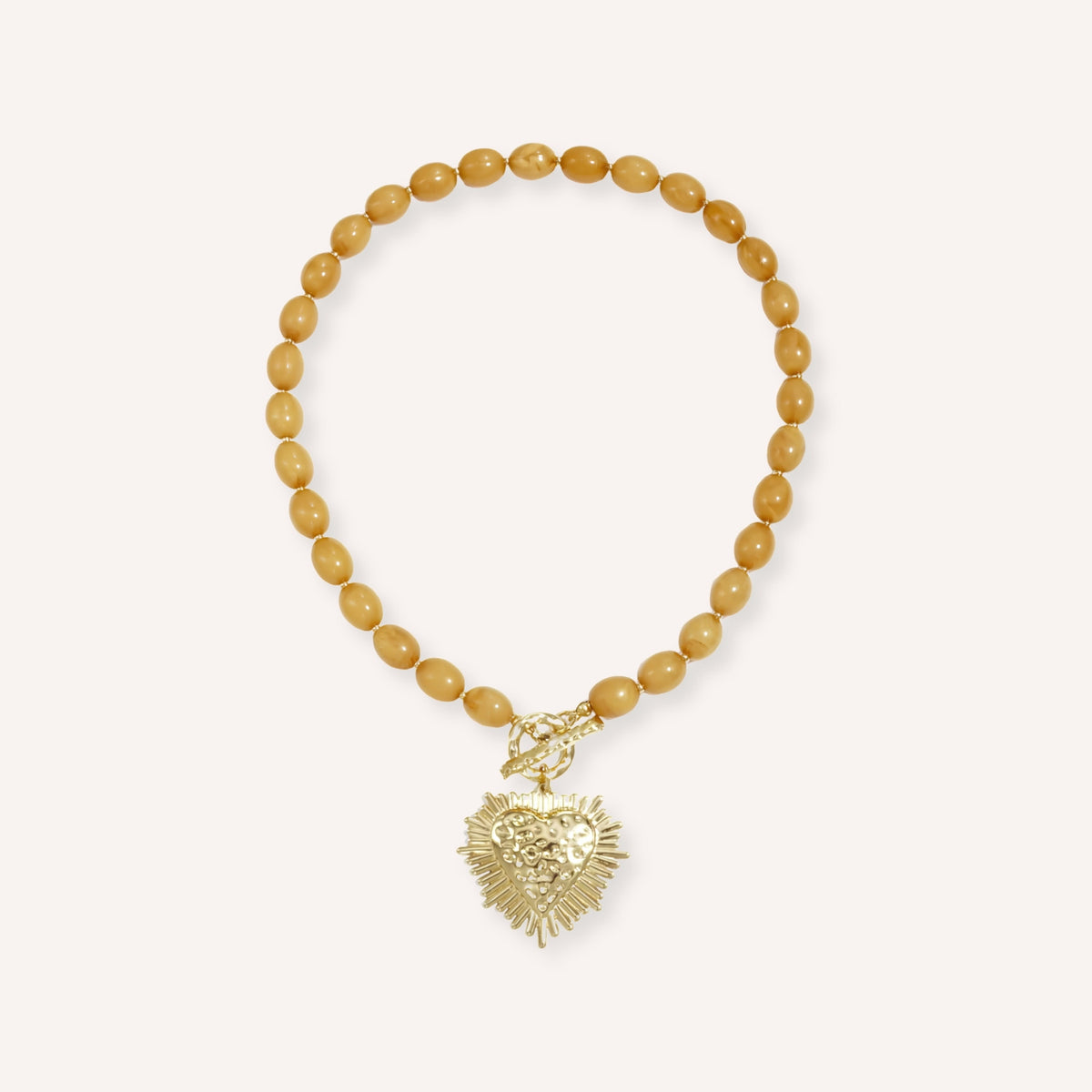 Miele Ketting, honingkleurige kralenketting met hart en stralenkrans
