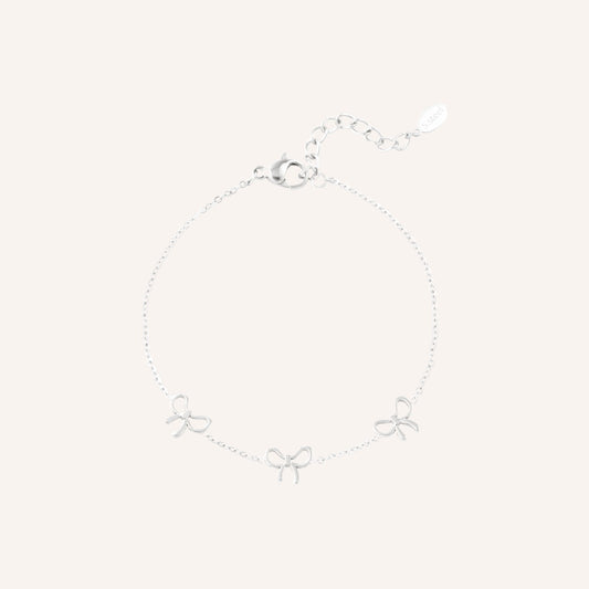Ponza Armband in zilver, zilverkleurige bedelarmband met strikjes