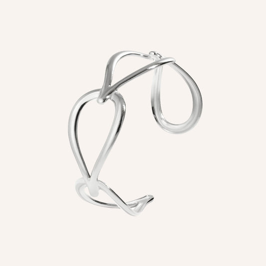 Rugiada Armband in zilver, zilverkleurige bangle met open druppelvormen